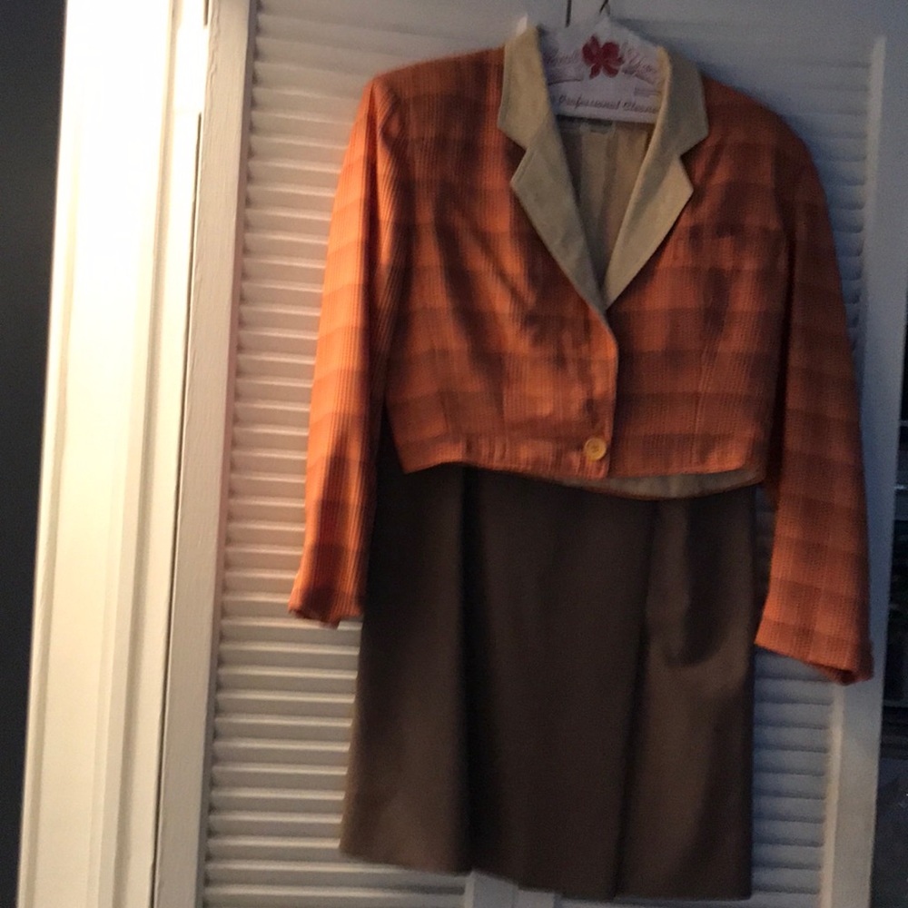 Two piece designer suit with waist length jacket